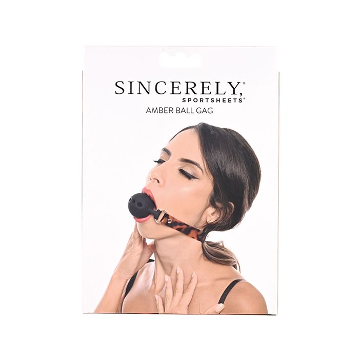 Sincerely Amber Luxury Ball Gag with gold accents on a black background.